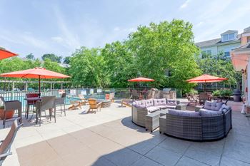 A patio with a table and chairs and umbrellas.at Riverview Landing @ Valley Forge, Pennsylvania, 19403